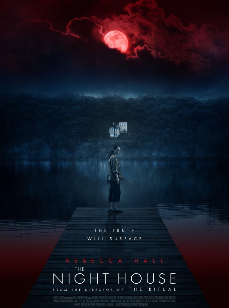 Film poster showing a woman standing alone at the end of a wooden dock at a lake in the dead of night. There is a shoreline in the background with a distant house beneath a red moon through heavy clouds. The text reads “The Night House.”