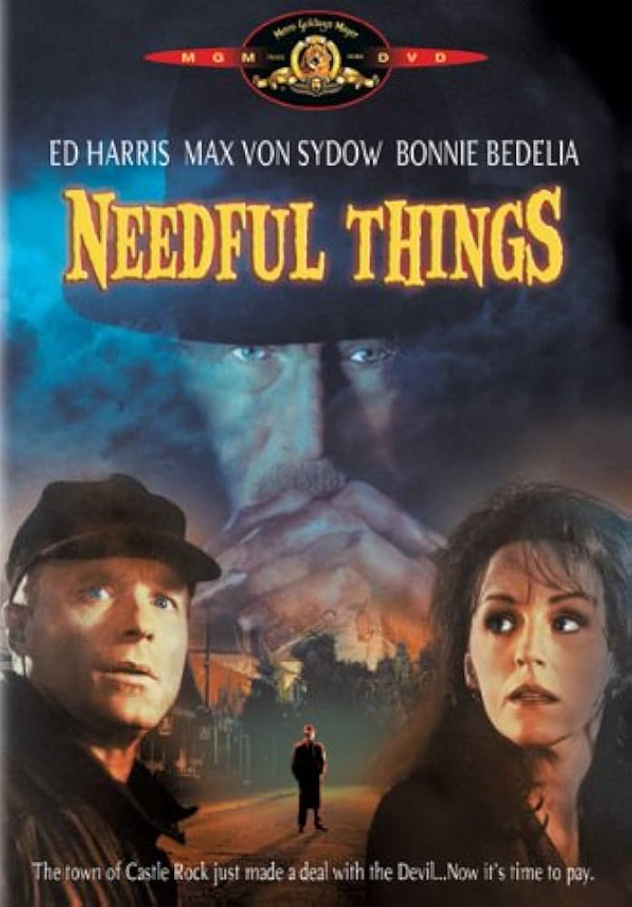 Cover for Needful Things (MGM). Ed Harris and Bonnie Bedelia appear in the foreground looking alarmed, while Max Von Sydow's face looms large in the background. The tagline reads: "The town of Castle Rock just made a deal with the Devil...Now it's time to pay."