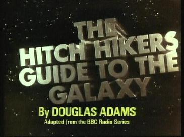 The title credits from the 1981 BBC miniseries reading "The Hitch Hikers Guide to the Galaxy by Douglas Adams — Adapted from the BBC Radio Series," displayed in metallic lettering against a starfield background.